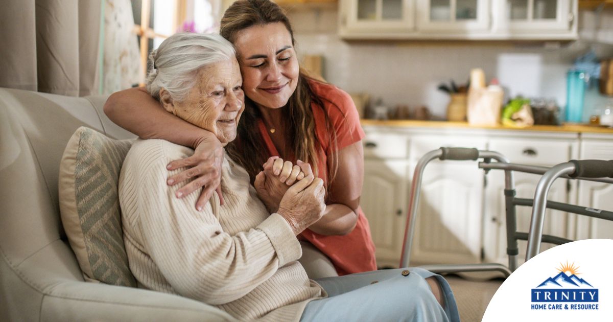 Caregiver supporting an elderly woman in the transition to senior home care