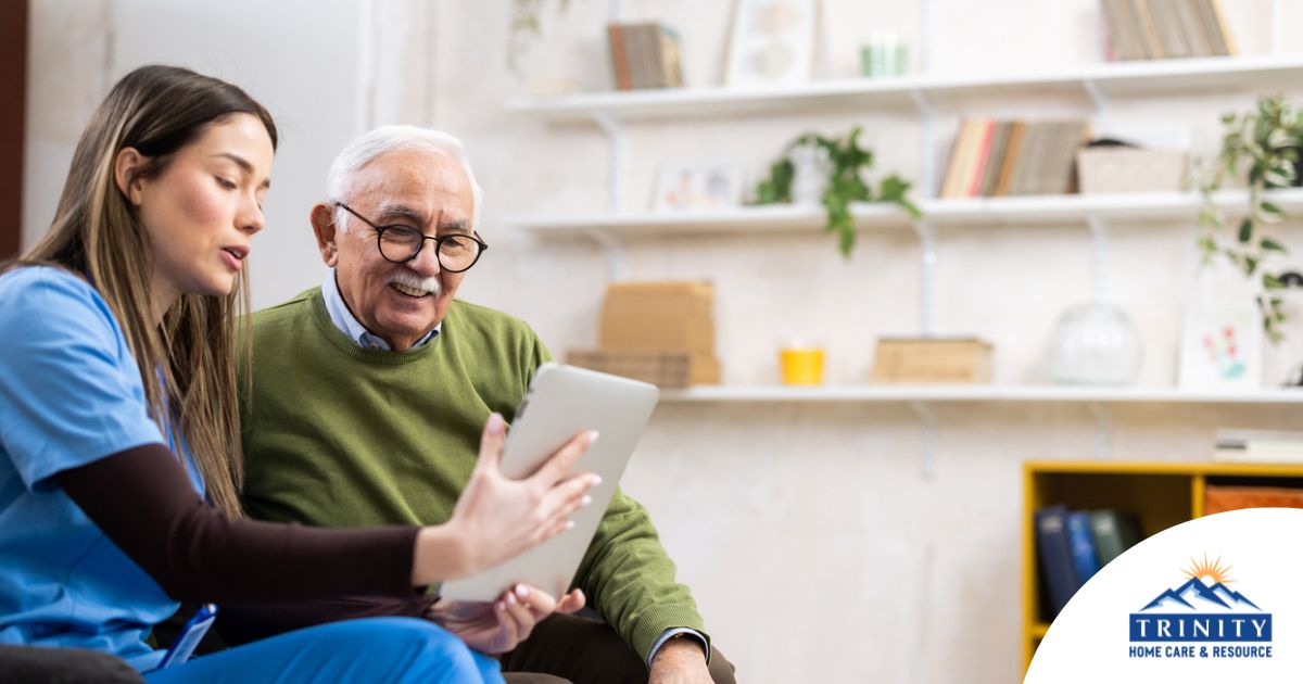 Home caregiver assisting senior man to use telehealth and senior care